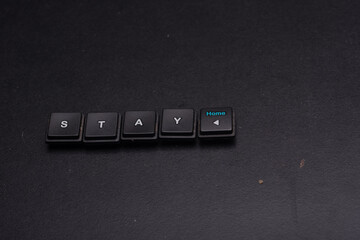 Stay at home message isolated over dark background, high angle shot