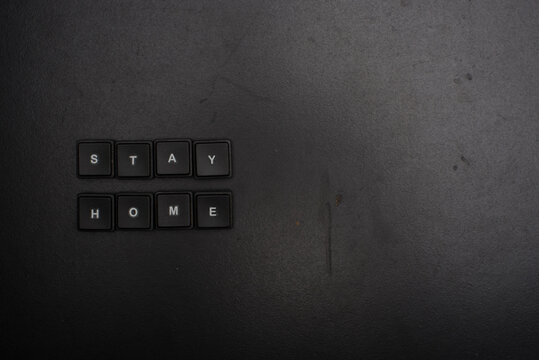 Stay at home message isolated over dark background, high angle shot