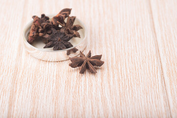 Star anise isolated over wooden background