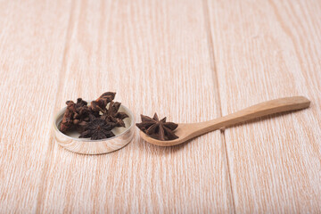 Star anise isolated over wooden background