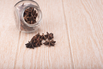 Star anise isolated over wooden background