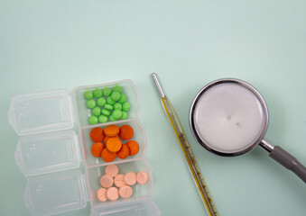 Pills and colored capsules out of the package. Color tablets and capsules from the wing view.
