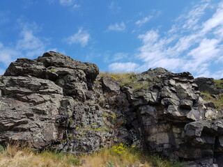 Fototapeta na wymiar Stone rocks against the blue sky