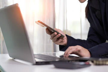 A business analyzing investment charts at workplace investment concept office with using a tablet computer 