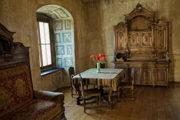 Fototapeta na wymiar ORAVA CASTLE, SLOVAKIA - JUNE 16, 2018: Orava Castle - interior. Room with old wooden furniture. Slovak Republic. Central Europe