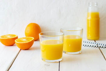 Freshly squeezed orange juice on a white background. Healthy eating. Diet. Vegetarian food.