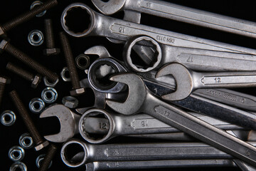 Industrial tools such as French wrenches and a variety of conventional wrenches from a close-up and...