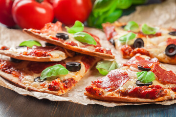 Slices of pizza pepperoni with olives