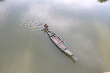 Fototapeta premium a boatman on river
