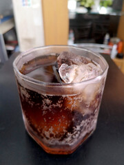 cola in glass with ice