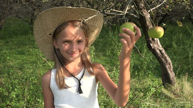 Farmer Child in Apple Orchard, Country Girl Tasting Studying Fruits in Tree, Kid at Village