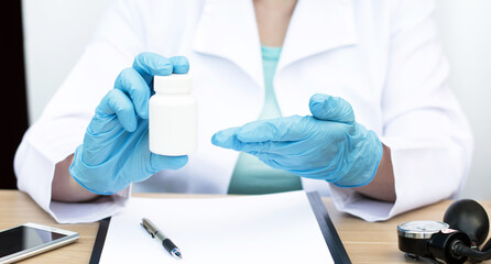 pills in the hands of a doctor close-up. Treatment concept