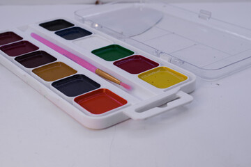 palette of watercolor paint on a white background