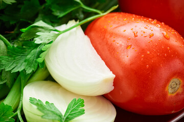 healthy food - fresh vegetables on a wooden background, tomatoes and greens