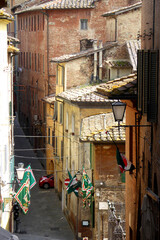 Streets in the medieval city centre of Siena in Tuscany Italy