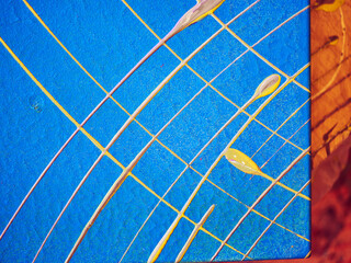 Texture of blue paint drawing on canvas using a pendulum. Creative work