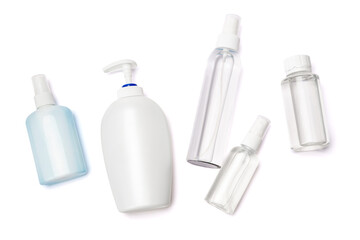 group of hand sanitizer spray and liquid soap bottles isolated on white background