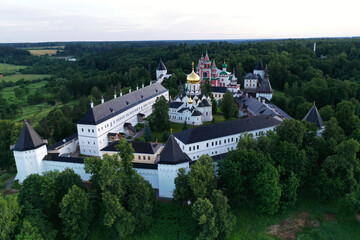 Fototapeta premium ancient white stone fortress at dawn taken from a drone