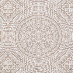 Pattern on a beige fabric in a mandala ornament. Fabric with natural texture, Cloth backdrop.