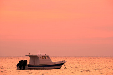 Speed boat during sunrise parked at Asker coast, Bahrain