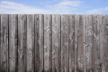 wooden wall fence plank background and cloudy sky for wallpaper