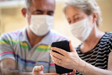 senior couple with masks