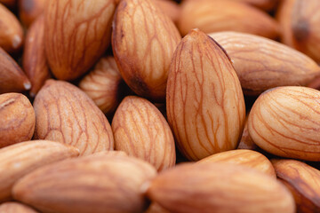 Almond beans soak in water overnight to get the most benefits before  to made almond milk, Health food with good fats and down aging, Antioxidants and lower cholesterol levels, Selective focus.