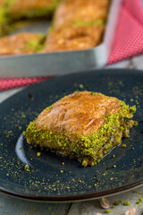 Traditional Turkish dessert in plate on wooden table