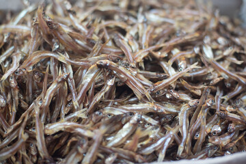 fruits, flowers and fish for sale at a market