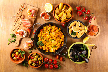 selection of spanish dish with paella, mussel, tapas