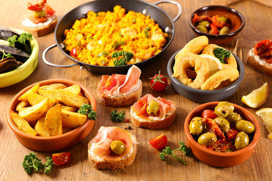 selection of spanish dish with paella, mussel, tapas