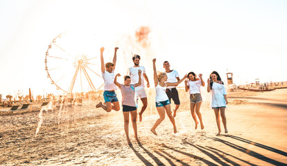 Happy friends group having fun at ferris wheel seaside - Summer vacations friendship concept with...