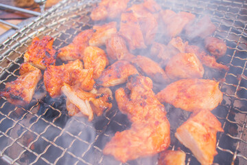 Charcoal grilled chicken with spicy and sweet sauce.