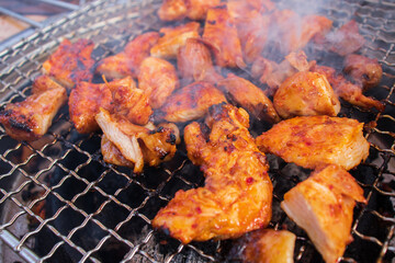 Charcoal grilled chicken with spicy and sweet sauce.