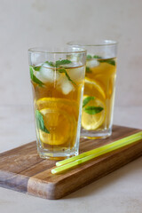 Cold tea with lemon and mint. A summer drink. Healthy eating. Vegetarian food. Diet.