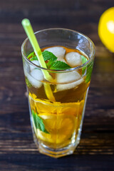 Cold tea with lemon and mint. A summer drink. Healthy eating. Vegetarian food. Diet.