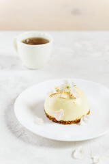 Raw mousse cake with a cup of tea. No sugar, gluten, lactose.