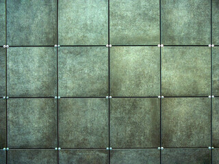 Wall  made of gray square tiles