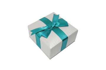 Small gift box with blue ribbon isolated on white background. Jewelry/holiday box close up