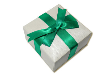Gift box with green ribbon isolated on white background. Small Jewelry/holiday box macro