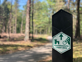 Bicycle path sign in the forest of Diffelen