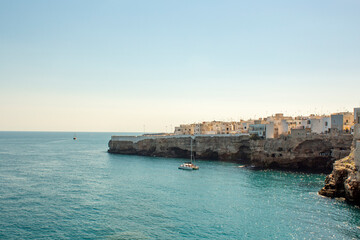 Fototapeta na wymiar Summer in Polignano a mare. View of Puglia' sea, near Bari. Panoramic view of sea polignano a mare, a city in Puglia ( apulia) during a sunny day. It is a very perfect turist destination in the summe