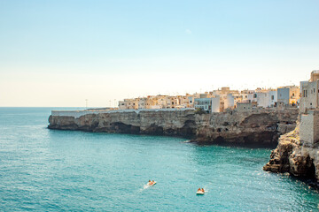 Fototapeta premium Summer in Polignano a mare. View of Puglia' sea, near Bari. Panoramic view of sea polignano a mare, a city in Puglia ( apulia) during a sunny day. It is a very perfect turist destination in the summe