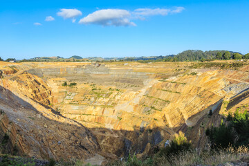 Open-cast mining. The gaping pit of the Martha gold mine in Waihi, New Zealand