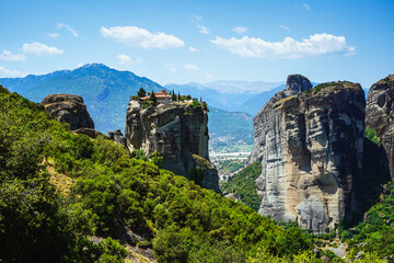 Fototapeta na wymiar View of the cliffs of Meteora, ancient Christian monasteries, a place of pilgrimage. Popular tourist route.