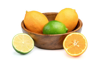 Fresh different citrus fruits isolated on white background. Fresh lemons Meyer and limes in the wooden bowl.