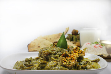 Cluster Beans Curry-Gwar ki Sabzi served with rice roti and Papad.selective focus.