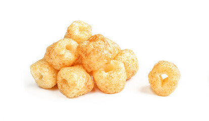 Pile of crispy peanut ring snacks isolated on white background.