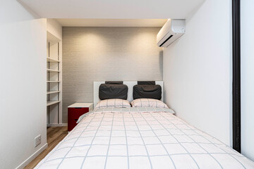 Single bed in modern small bedroom at apartment