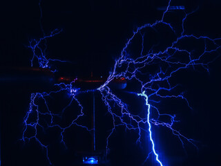 Loose electrical discharge with many branches similar to lightning in the dark